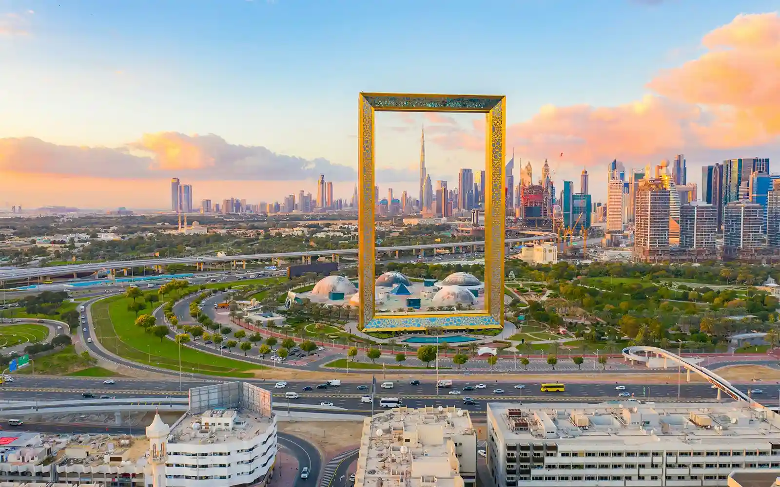 Tourists walking on the glass bridge at Dubai Frame